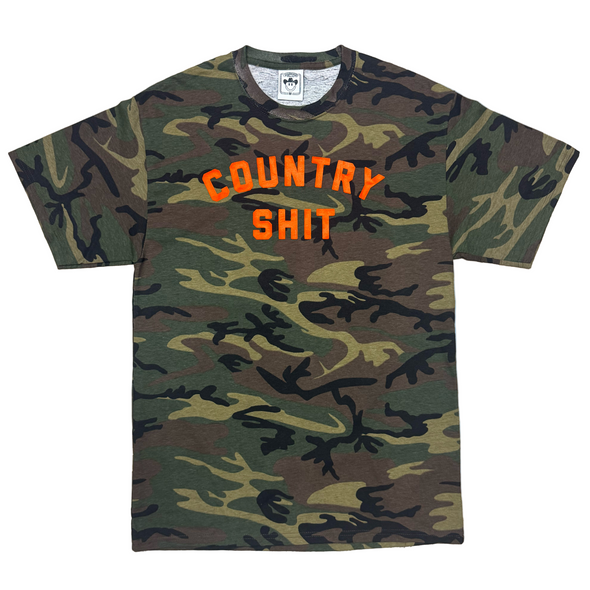 Camouflage t-shirt with 'COUNTRY SHIT' text on a white background