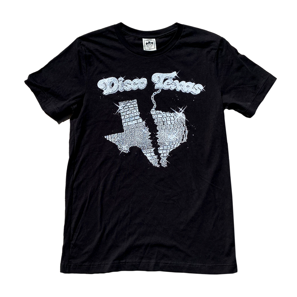 "Disco Texas" by Vinyl Ranch features a metallic silver and white design on a classic black tee. Check out the full Disko Cowboy Collection