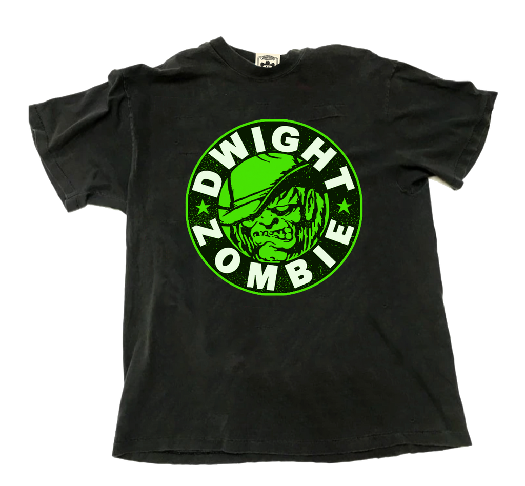 "Dwight Zombie" by Vinyl Ranch is a neon green & white design printed on a classic black tee.
