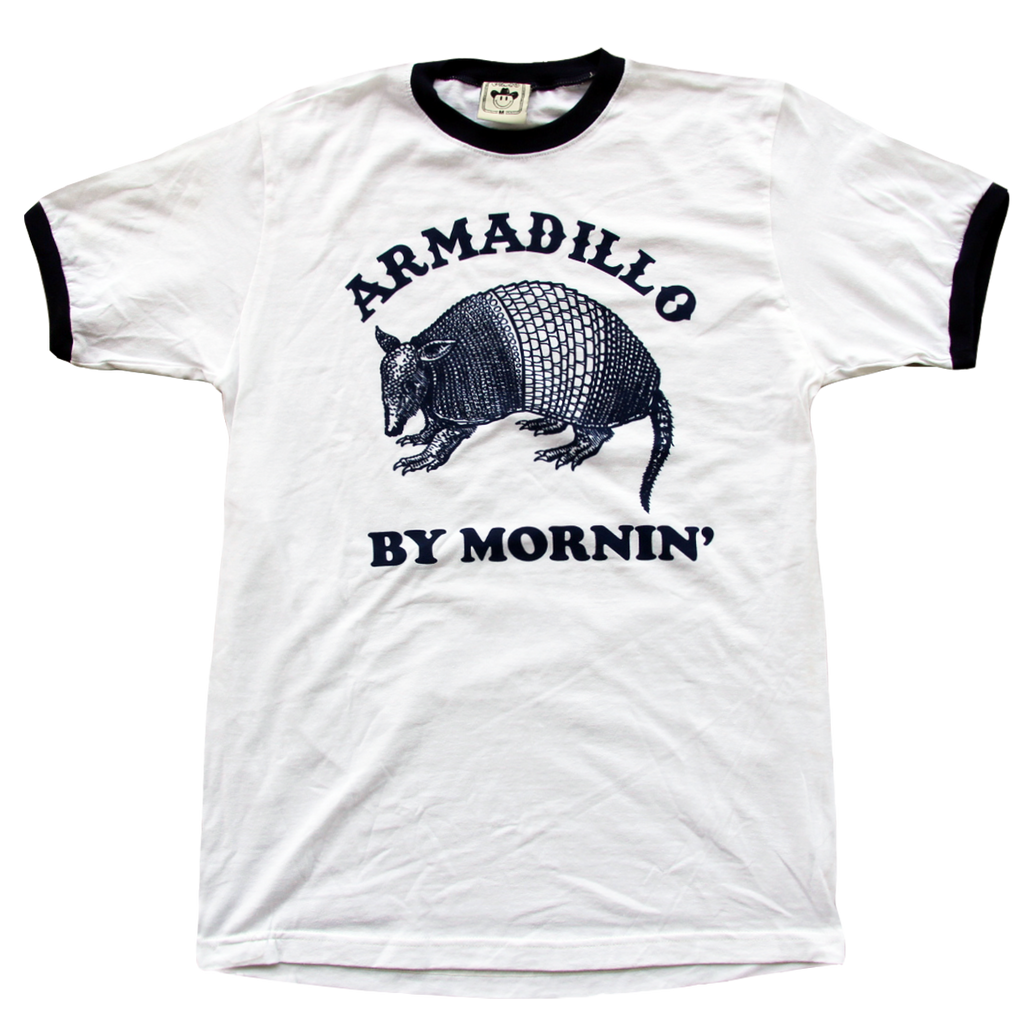 "Armadillo By Mornin'" printed on a navy & white ringer tee by Vinyl Ranch.