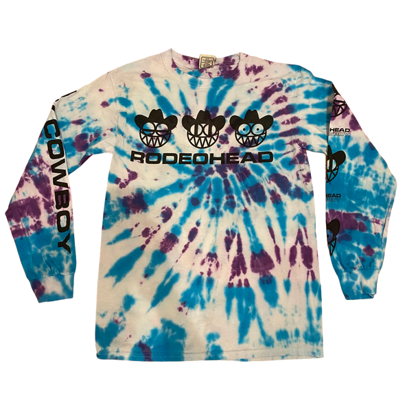 "OK Cowboy Rodeohead" by Vinyl Ranch is a limited edition tie-dye version of this design printed on a longsleeve tee. These are individually dyed, one of a kind, and each tee is unique.  NO EXCHANGES ON THESE ITEMS