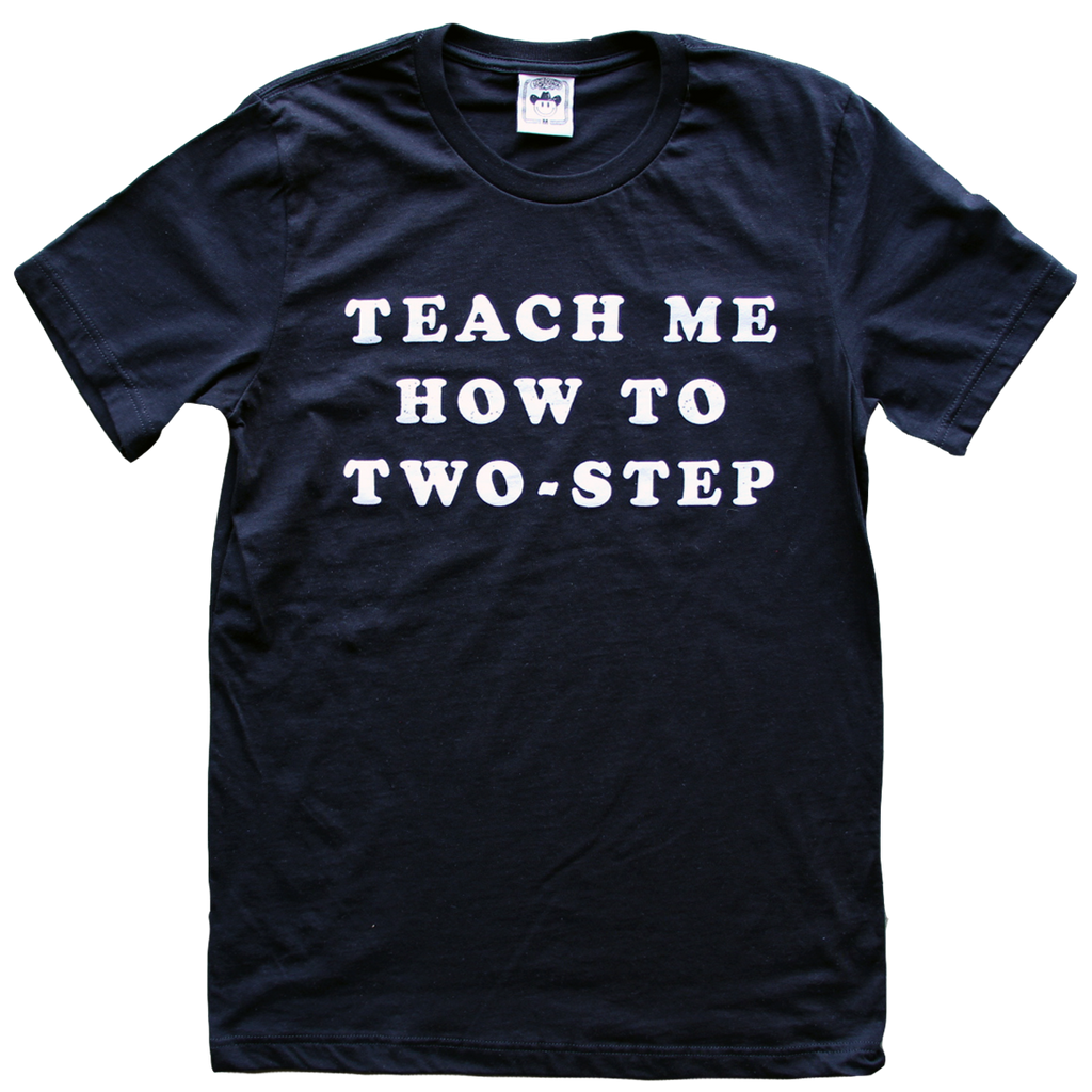 "Teach Me How To Two-Step" by Vinyl Ranch is a vintage-inspired design printed in white on a classic black tee.